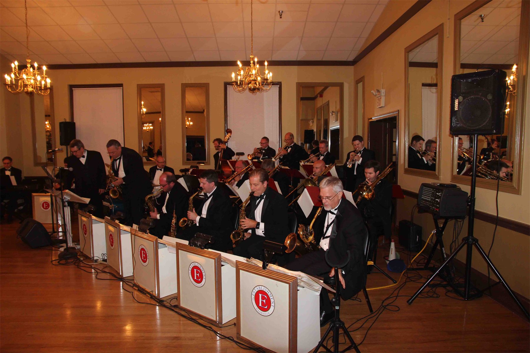 The Establishment performing in formal concert attire