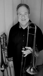 Jeff Adams holding a trombone