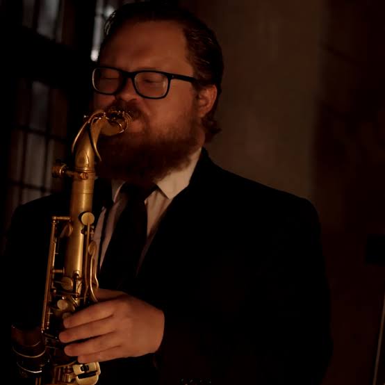 Zach Tyler performing on tenor saxophone